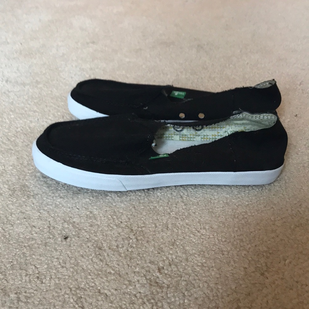 Never worn! Black canvas slip-ons.